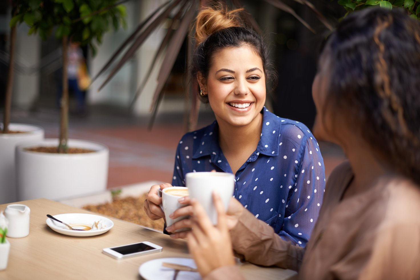 Two friends meeting up for a coffee